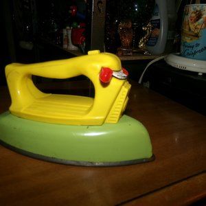 very vintage hard plastic & metal toy iron.